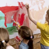 close-up-children-painting-together
